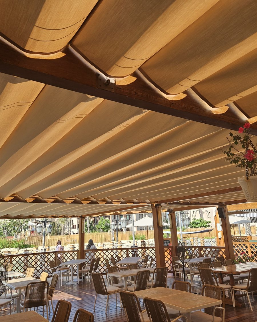 Timber pergola shading an outdoor dining terrace